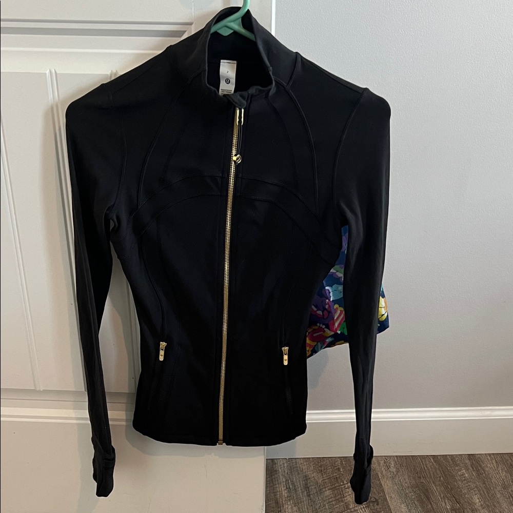 lululemon athletica Black Jacket with Gold Accents only wore one time.